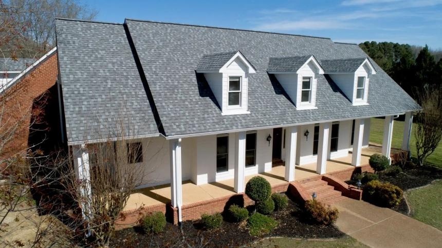 Roofing — white house with new gray shingle roof