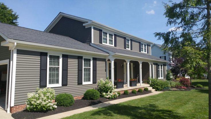 Siding — gray vinyl siding with black shutters